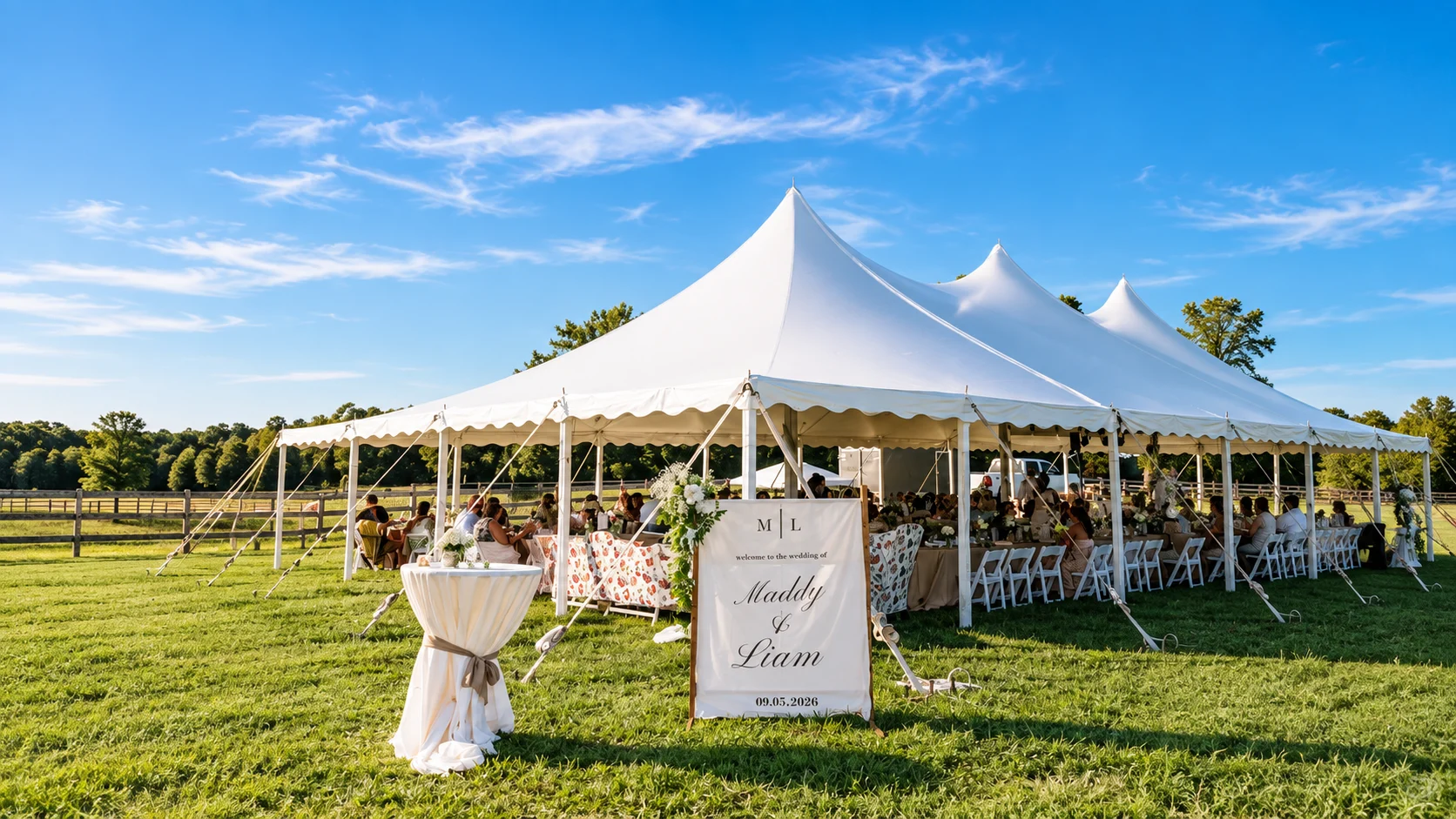 Wedding reception under the white tent on the lawn at Marble Head Farm